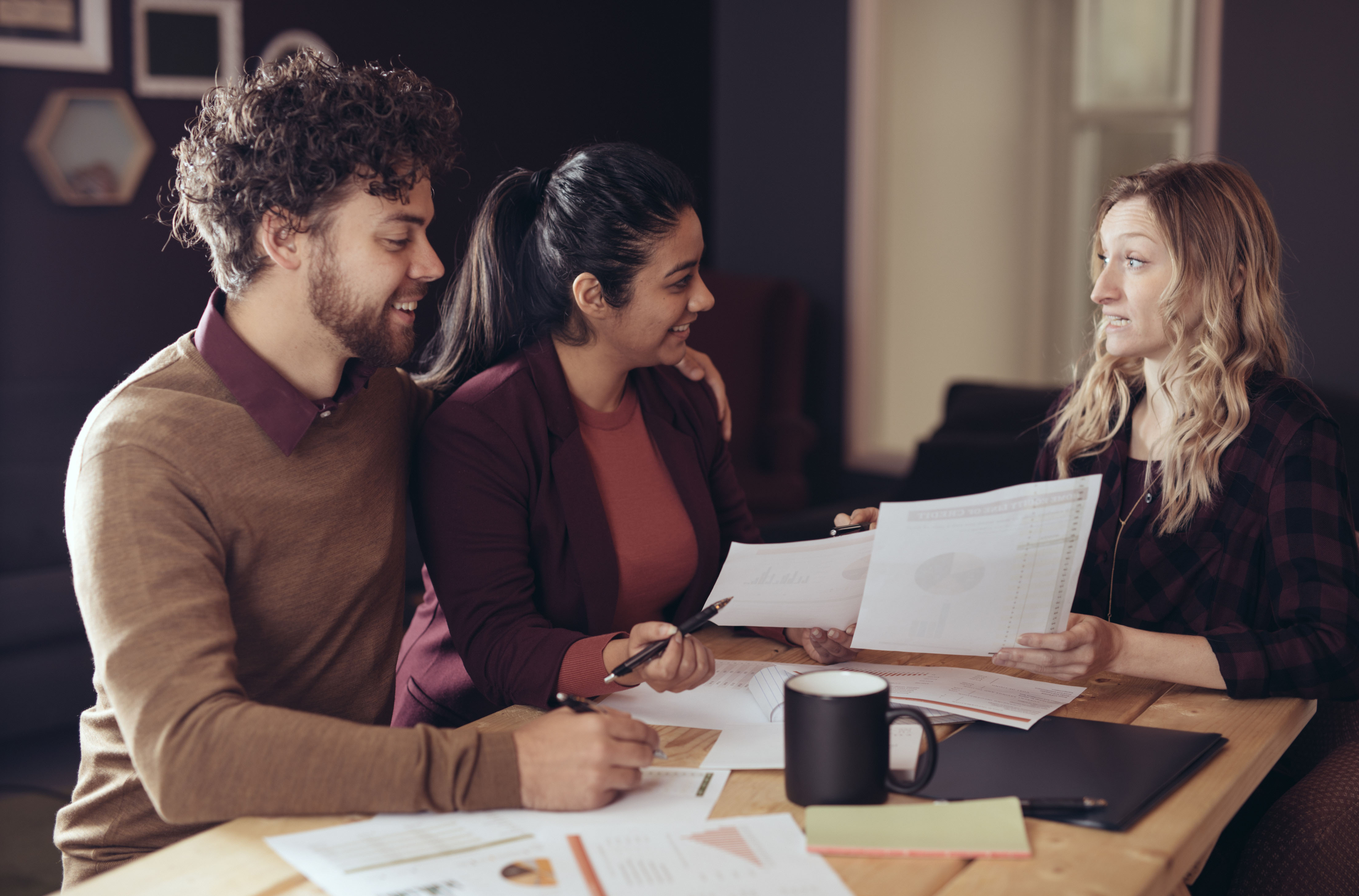 Homebuyers discussing mortgage rates with a lender