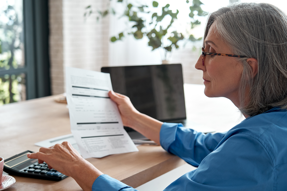 Woman looking over documentation in divorce