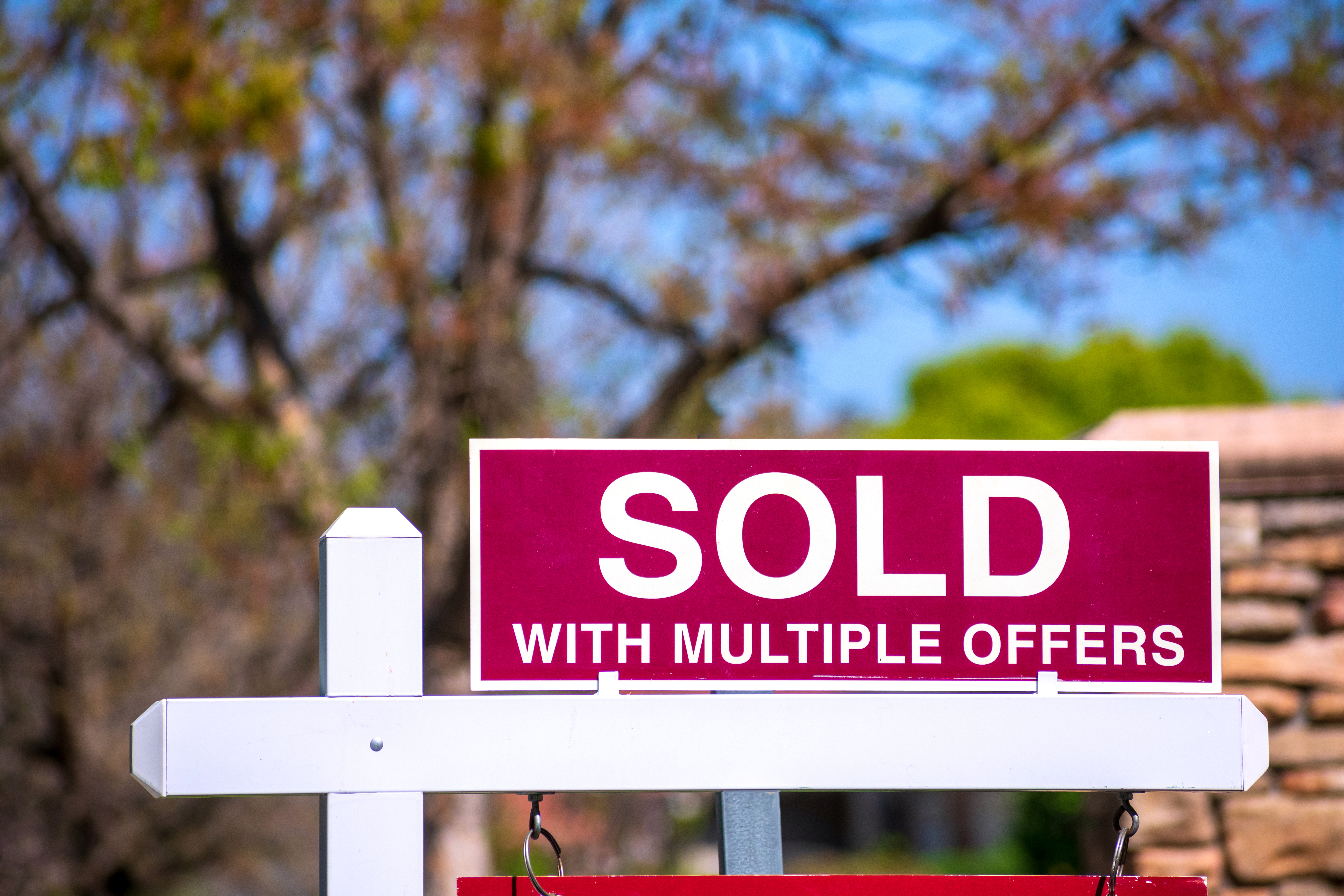 A sign saying sold with multiple offers